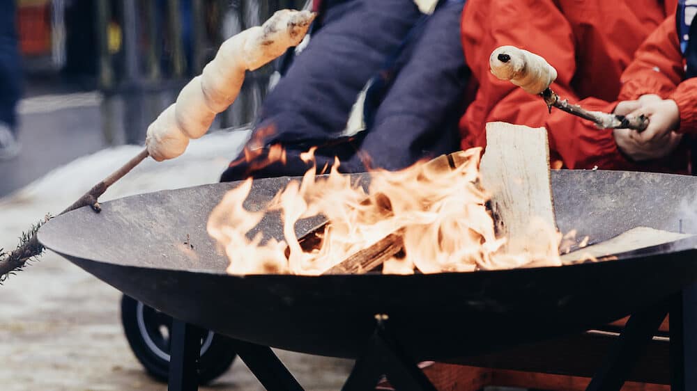 Roasting twist bread on open fireplace
