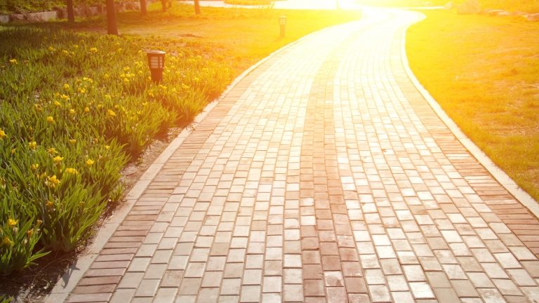 a stone path at sunset